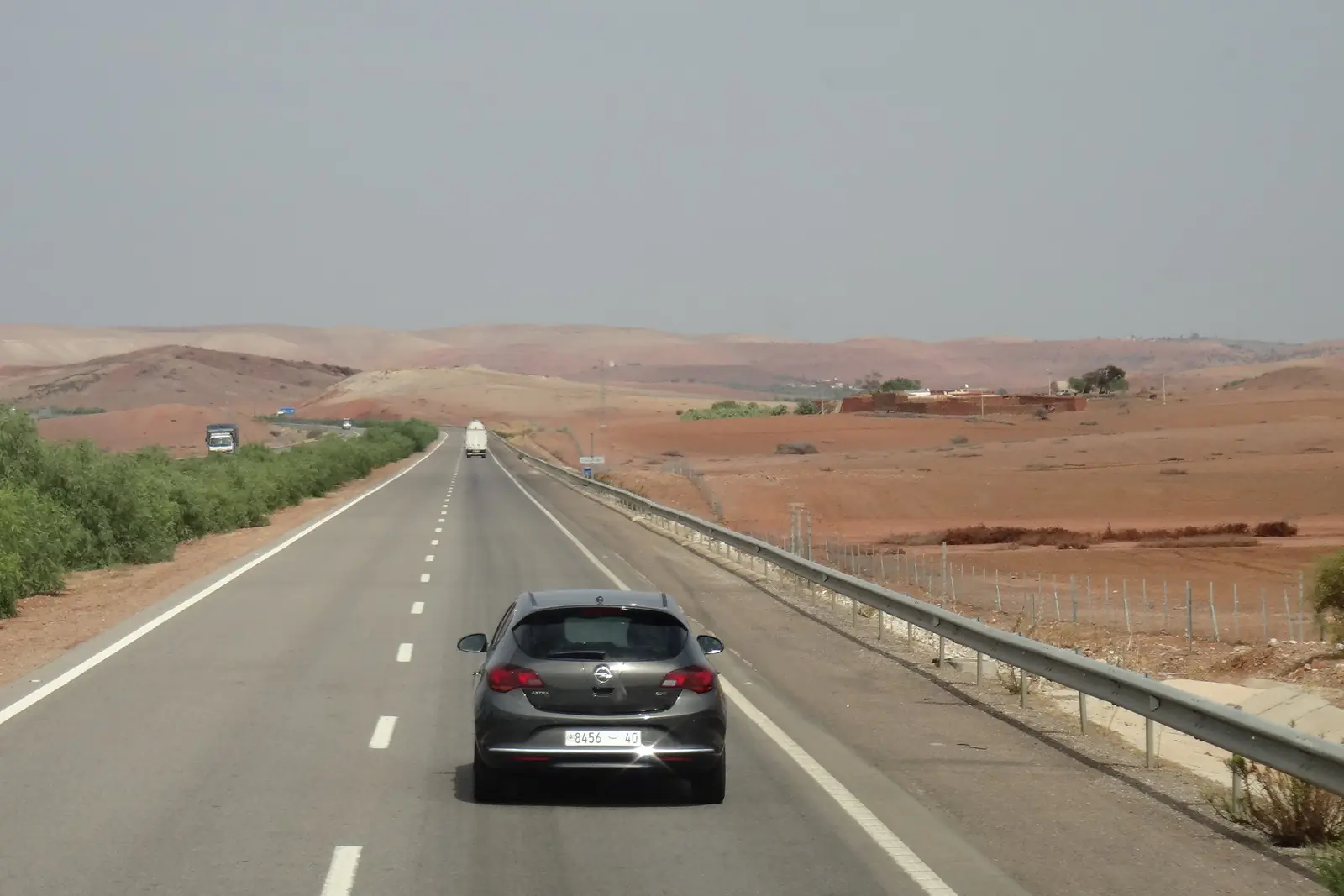 Two-lane road crossing open country in Settat province
